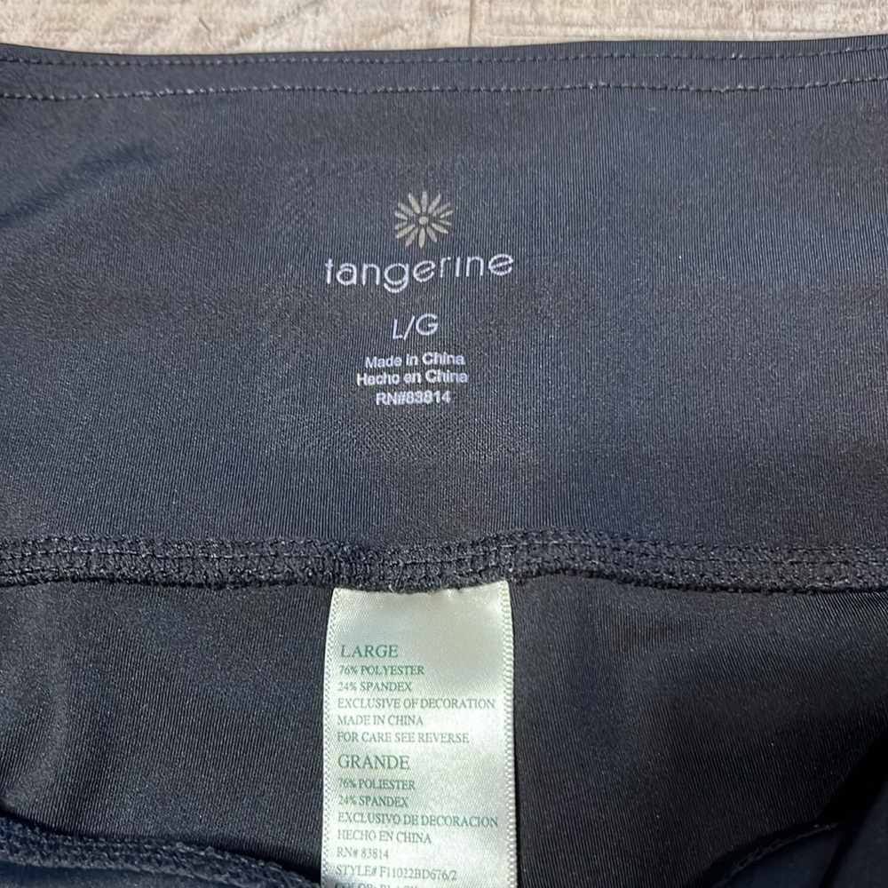 3:$25 Tangerine capri leggings with cute cut outs down outside of each calf. - Picture 4 of 5